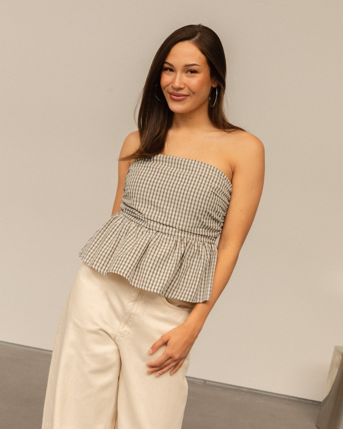 LEIA CHECK PEPLUM TOP BRUIN